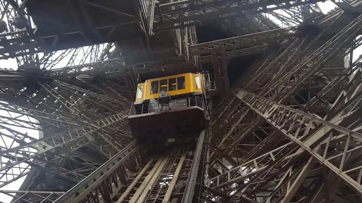 Tourists enjoying the view from the Eiffel Tower platform